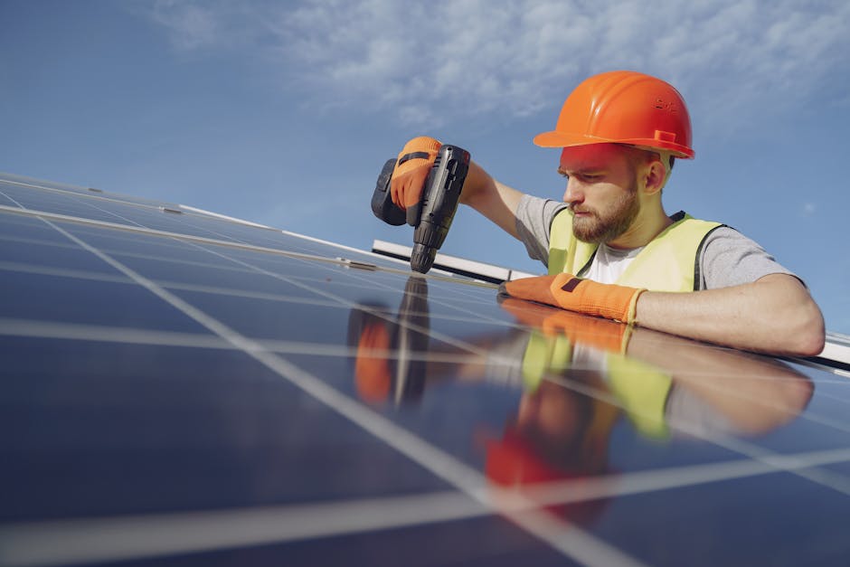 Professional solar installation expert reviewing plans on site.
